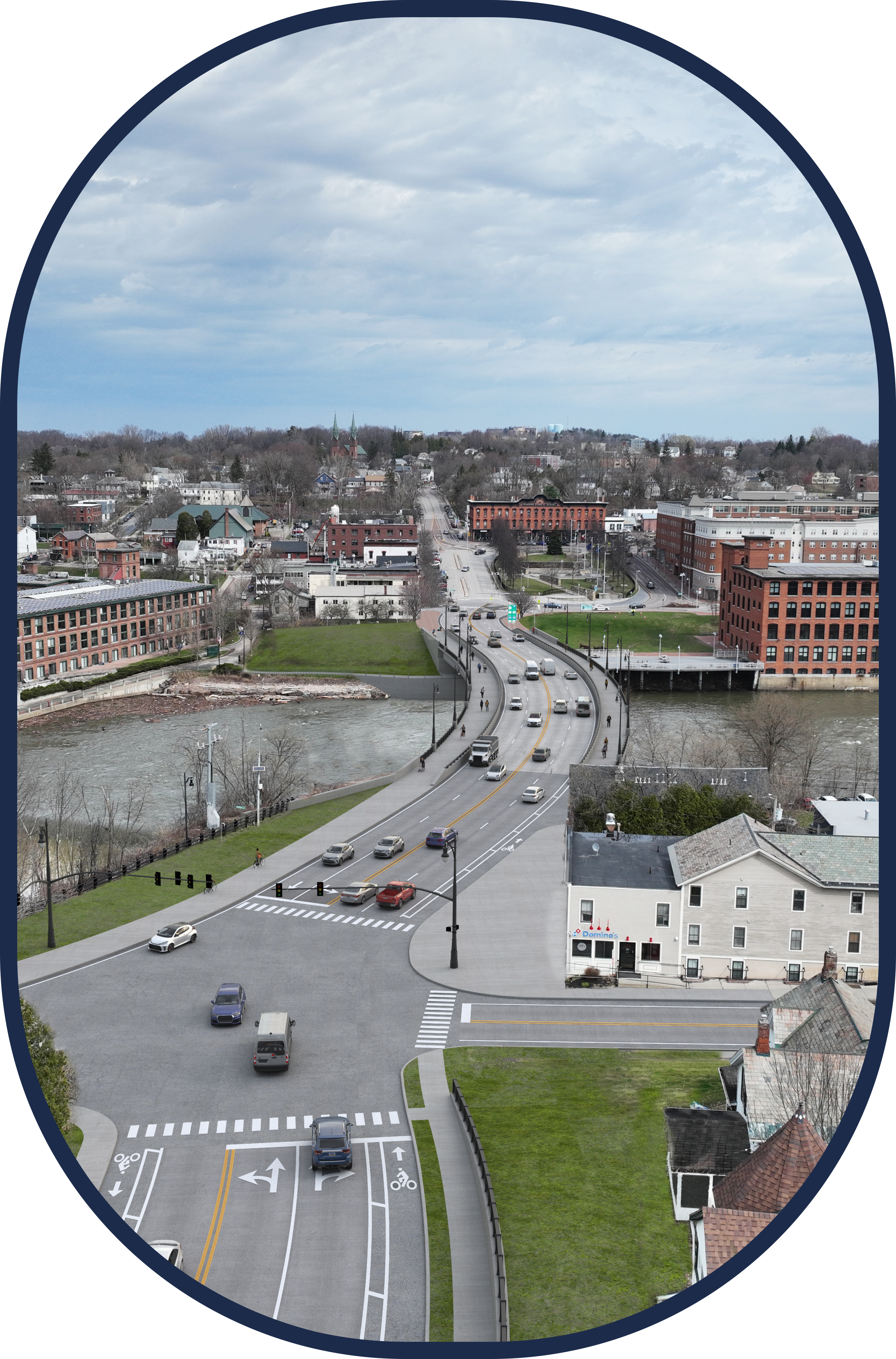 An aerial view of a newly constructed bridge spanning a river, connecting two parts of a city. Commercial buildings and parking lots line one side, while residential houses with green yards and trees are on the other. The river has greenish water, and nearby, there’s an intersection with traffic lights and pedestrian crossings.